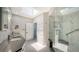 Luxurious bathroom with marble finishes and a large glass shower at 535 Sanctuary Dr # C807, Longboat Key, FL 34228