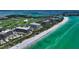 Aerial view showing building location and proximity to beach and golf course at 535 Sanctuary Dr # C807, Longboat Key, FL 34228