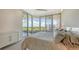 Bright bedroom with a comfortable bed and access to balcony at 535 Sanctuary Dr # C807, Longboat Key, FL 34228