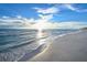 Scenic beach view with gentle waves lapping the shore at 535 Sanctuary Dr # C807, Longboat Key, FL 34228