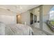 Comfortable bedroom with balcony access and plenty of light at 535 Sanctuary Dr # C807, Longboat Key, FL 34228