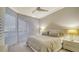 Serene bedroom with large window and modern window treatments at 535 Sanctuary Dr # C807, Longboat Key, FL 34228