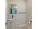 Elegant powder room with marble vanity and modern fixtures at 535 Sanctuary Dr # C807, Longboat Key, FL 34228