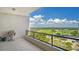 Relaxing balcony overlooking a golf course and city skyline at 535 Sanctuary Dr # C807, Longboat Key, FL 34228