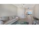 Spacious home office with sofa and view into living area at 535 Sanctuary Dr # C807, Longboat Key, FL 34228