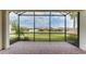 Spacious screened patio overlooking a tranquil lake at 5431 Taliaferro Ct, Palmetto, FL 34221