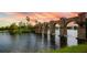 Picturesque lake with stone bridge and fountain at 5431 Taliaferro Ct, Palmetto, FL 34221
