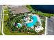 Community pool and clubhouse with lush landscaping at 5431 Taliaferro Ct, Palmetto, FL 34221