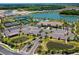 Community overview showcasing amenities and lake at 5431 Taliaferro Ct, Palmetto, FL 34221