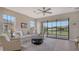 Bright living room with comfy seating and sliding glass doors to patio at 5431 Taliaferro Ct, Palmetto, FL 34221