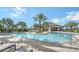 Inviting community pool with ample lounge chairs at 5431 Taliaferro Ct, Palmetto, FL 34221