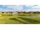 Wonderful backyard view of homes and lake at 5431 Taliaferro Ct, Palmetto, FL 34221