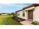 Single-story home exterior with landscaped yard and walkway at 5431 Taliaferro Ct, Palmetto, FL 34221