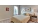 Guest bedroom with window and neutral decor at 5431 Taliaferro Ct, Palmetto, FL 34221