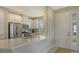 Modern kitchen with white cabinets and stainless steel appliances at 5431 Taliaferro Ct, Palmetto, FL 34221