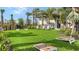Enjoy cornhole and relax in this community lawn with artificial turf at 5431 Taliaferro Ct, Palmetto, FL 34221