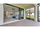 View of patio and living room through sliding doors at 5431 Taliaferro Ct, Palmetto, FL 34221