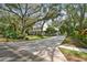 Two-story home exterior with driveway and landscaping at 6008 Hammock Woods Dr, Odessa, FL 33556