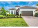 Single-story home with landscaping and driveway at 6249 Mesa Gln, Bradenton, FL 34203