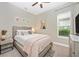 Bright bedroom with queen bed, neutral decor, and window at 6249 Mesa Gln, Bradenton, FL 34203