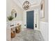 Elegant entryway with modern chandelier and console table at 6249 Mesa Gln, Bradenton, FL 34203