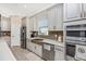 Updated kitchen with stainless steel appliances and a farmhouse sink at 6249 Mesa Gln, Bradenton, FL 34203