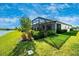 Landscaped backyard with a screened patio at 6249 Mesa Gln, Bradenton, FL 34203