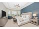 Spacious main bedroom with a large bed and sitting area at 6249 Mesa Gln, Bradenton, FL 34203