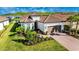 Single-story home with landscaping and driveway at 6249 Mesa Gln, Bradenton, FL 34203