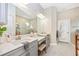 Elegant bathroom with double vanity, large mirror, and shower at 6249 Mesa Gln, Bradenton, FL 34203