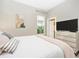 King bedroom with large window and en-suite bathroom access at 6249 Mesa Gln, Bradenton, FL 34203