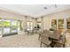 Community room features a ping pong table, seating area, and pool view at 6249 Mesa Gln, Bradenton, FL 34203