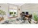 Spacious home office with wood desk, neutral color scheme, and ample natural light at 6249 Mesa Gln, Bradenton, FL 34203