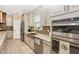 Updated kitchen with stainless steel appliances and a farmhouse sink at 6249 Mesa Gln, Bradenton, FL 34203