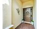Inviting entryway with decorative wreath and potted plants at 6249 Mesa Gln, Bradenton, FL 34203