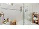 Large walk-in shower with tiled walls and built-in shelving at 6249 Mesa Gln, Bradenton, FL 34203