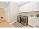 Functional laundry room, featuring a washer, dryer, and extra storage at 6249 Mesa Gln, Bradenton, FL 34203