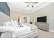 Spacious bedroom with large bed, TV, and plenty of natural light at 6249 Mesa Gln, Bradenton, FL 34203