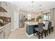 Modern kitchen with stainless steel appliances, large island, and neutral cabinetry at 6249 Mesa Gln, Bradenton, FL 34203