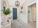 Elegant entryway with modern chandelier and console table at 6249 Mesa Gln, Bradenton, FL 34203