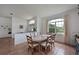 Cozy dining area features a large window and ample seating with a partial view of the entryway at 6637 Pleasant Hill Rd, Bradenton, FL 34203