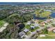 Aerial view of a luxurious golf course community with houses and lakes at 6637 Pleasant Hill Rd, Bradenton, FL 34203