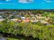 An aerial view showcasing a single-Gathering home with a backyard nestled in a neighborhood at 7115 39Th E Ln, Sarasota, FL 34243