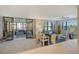 Spacious living room with sliding glass doors leading to balcony at 8779 Midnight Pass Rd # 206H, Sarasota, FL 34242