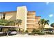 Building exterior with landscaping and parking at 8779 Midnight Pass Rd # 206H, Sarasota, FL 34242