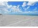 Expansive view of the beach with blue water at 8779 Midnight Pass Rd # 206H, Sarasota, FL 34242
