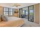 Main bedroom with water views and access to a private balcony at 8779 Midnight Pass Rd # 206H, Sarasota, FL 34242