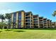 Attractive condo building with lush landscaping at 8779 Midnight Pass Rd # 206H, Sarasota, FL 34242