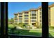 Community view with courtyard and building at 8779 Midnight Pass Rd # 206H, Sarasota, FL 34242