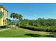 Waterfront view with lush landscaping at 8779 Midnight Pass Rd # 206H, Sarasota, FL 34242